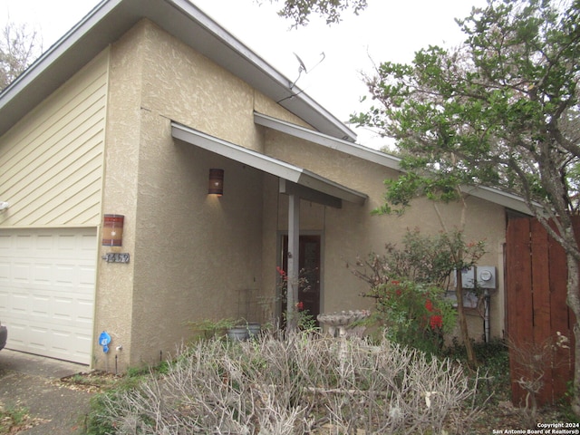 view of side of property featuring a garage