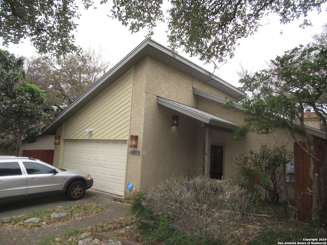 view of property exterior with a garage