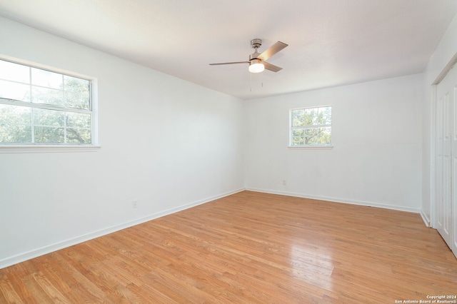 spare room featuring ceiling fan and light hardwood / wood-style floors