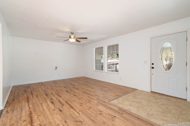 foyer featuring ceiling fan and light wood-type flooring