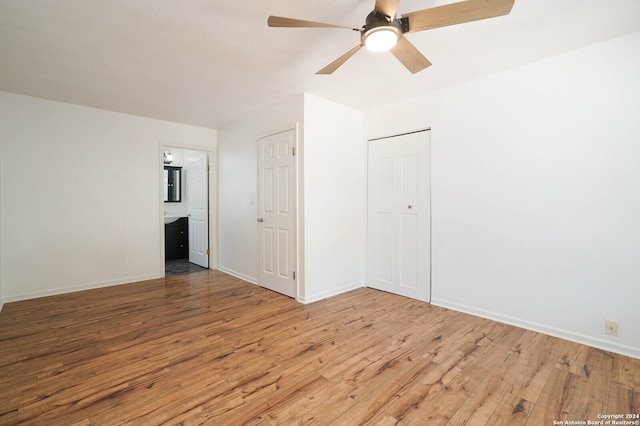 empty room with light hardwood / wood-style floors and ceiling fan