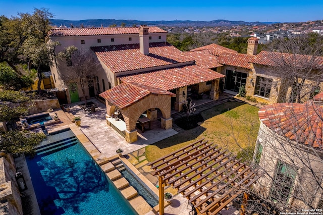 birds eye view of property with a mountain view