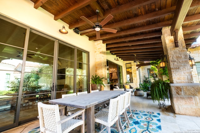 view of patio featuring ceiling fan