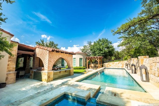 view of pool with an in ground hot tub, a pergola, and a patio area