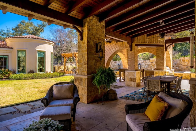 view of patio / terrace with area for grilling, ceiling fan, and outdoor lounge area