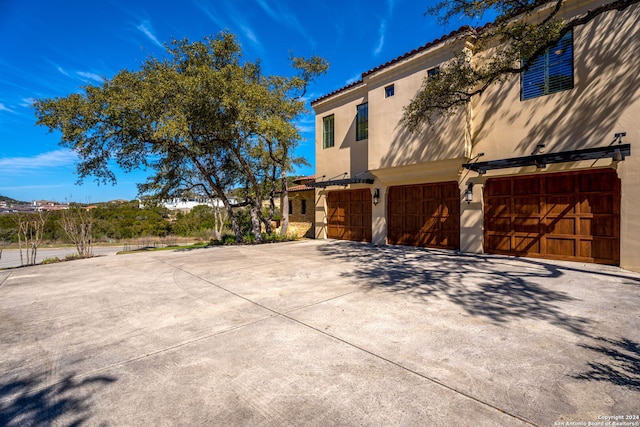 view of side of property with a garage