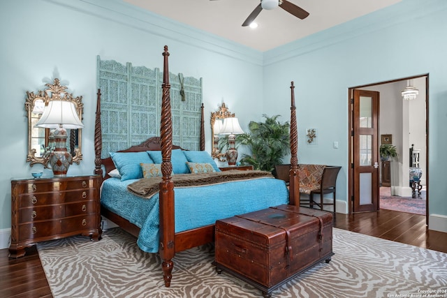 bedroom with ceiling fan, ornamental molding, and hardwood / wood-style floors