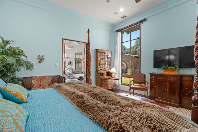 bedroom with ceiling fan and ornamental molding