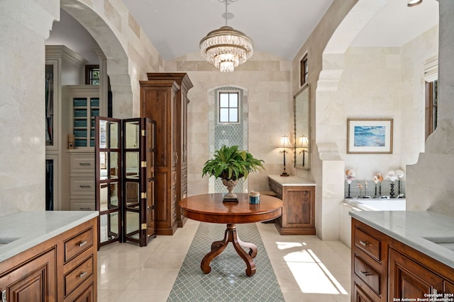 bathroom with tile walls, tile patterned floors, and vanity