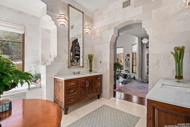 bathroom with tile walls and tile patterned flooring