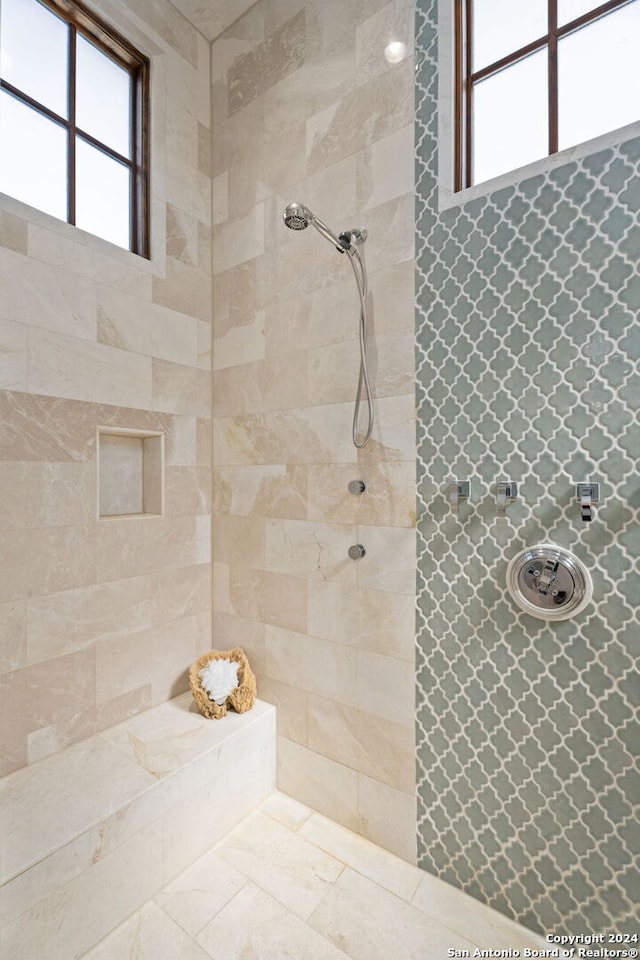 bathroom with a tile shower