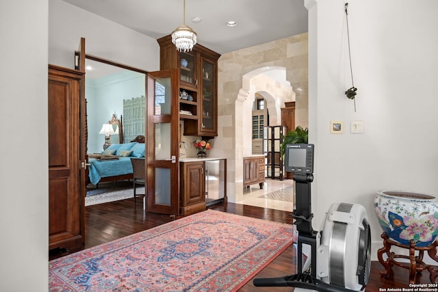 interior space featuring beverage cooler and dark wood-type flooring