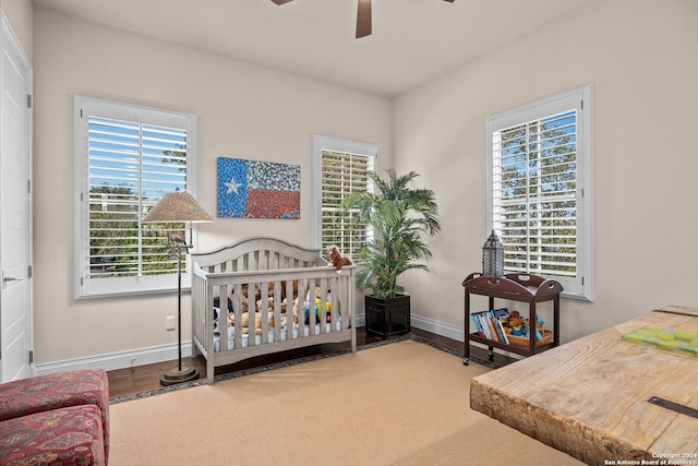 bedroom with ceiling fan and wood-type flooring