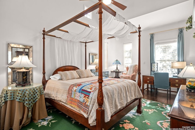 bedroom featuring dark hardwood / wood-style flooring and ceiling fan