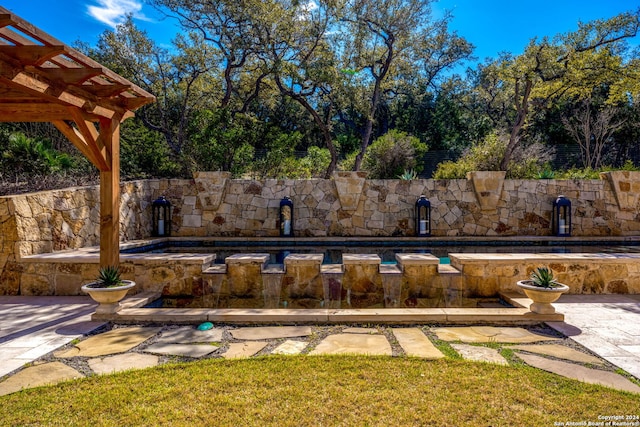 view of pool featuring a pergola and a patio