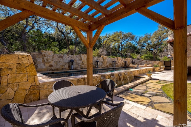 view of patio / terrace featuring a fenced in pool and a pergola