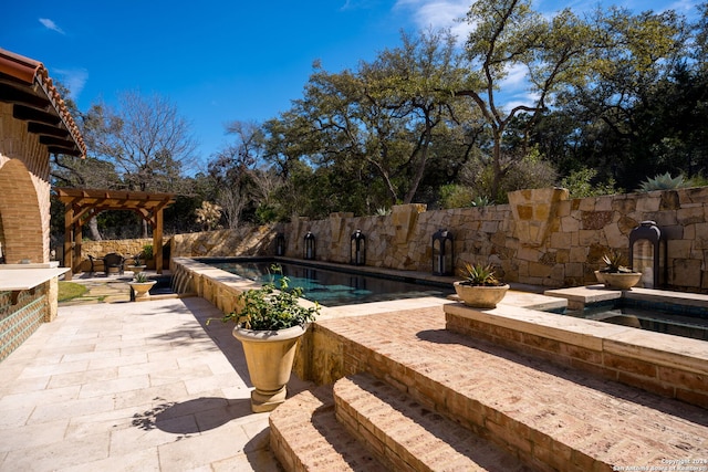 view of pool featuring a patio and a pergola