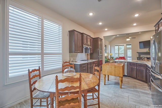 dining area featuring ceiling fan and sink