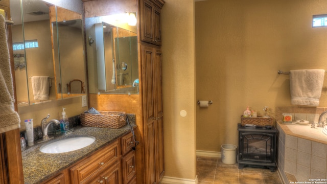 bathroom with vanity, tile flooring, and a wood stove