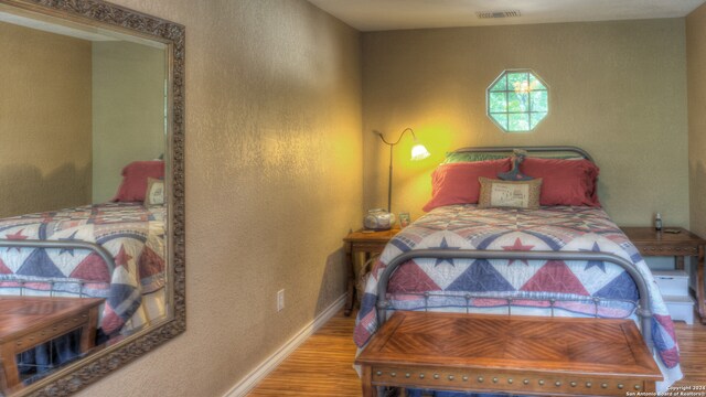 bedroom featuring hardwood / wood-style floors