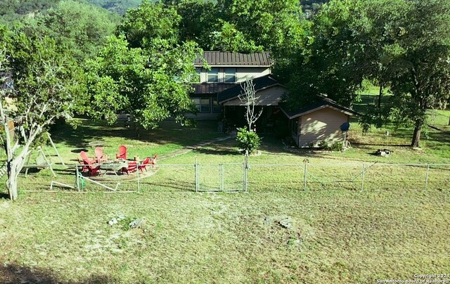 view of yard featuring a storage unit and a rural view