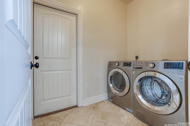 laundry room featuring light tile patterned flooring and independent washer and dryer