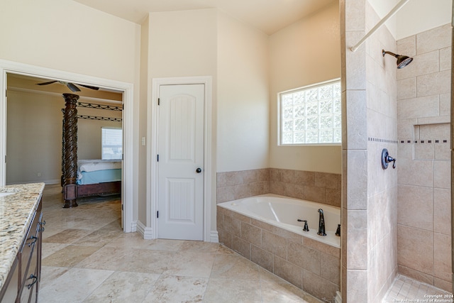 bathroom featuring vanity, ceiling fan, and shower with separate bathtub