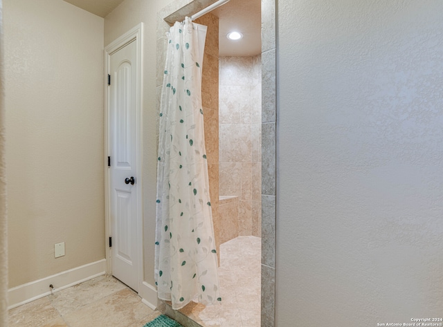 bathroom with a shower with curtain