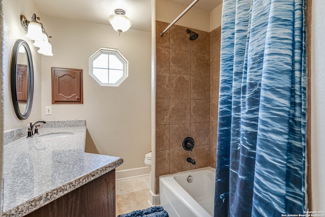 full bathroom with tile patterned floors, vanity, toilet, and shower / bath combo with shower curtain