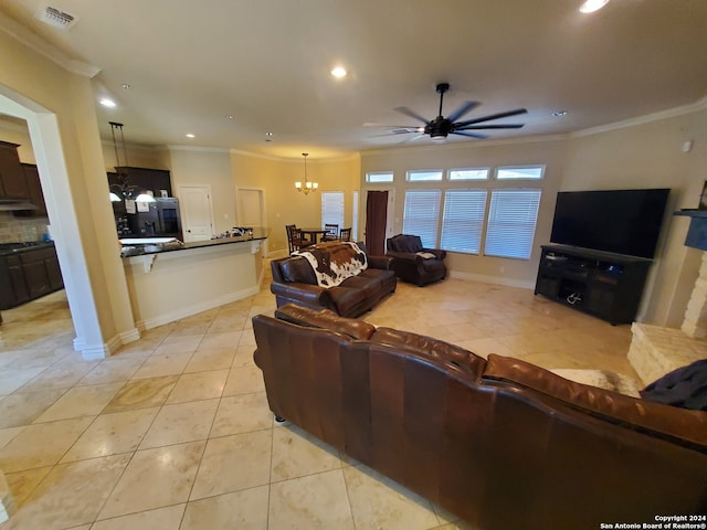 tiled living room with crown molding and ceiling fan with notable chandelier