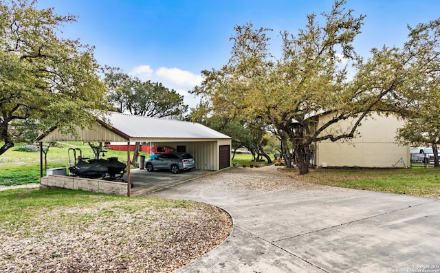 exterior space with a lawn and a carport