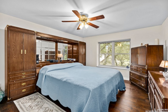 bedroom featuring dark hardwood / wood-style floors and ceiling fan