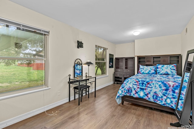 bedroom with hardwood / wood-style flooring