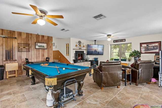 playroom featuring wooden walls, pool table, and ceiling fan