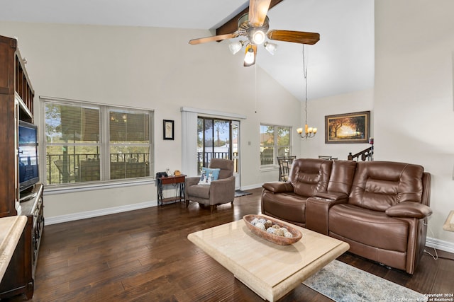 living room featuring dark wood-type flooring, high vaulted ceiling, and ceiling fan with notable chandelier