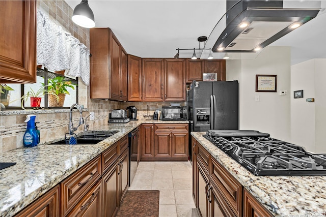 kitchen with backsplash, hanging light fixtures, island exhaust hood, and black appliances