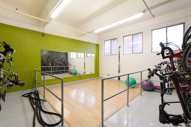 workout area with wood-type flooring