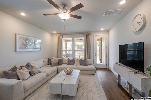 living room featuring ceiling fan and light wood-type flooring