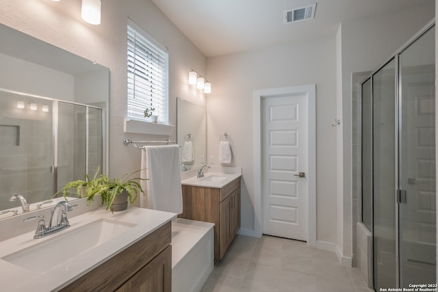 bathroom with double sink, tile flooring, and vanity with extensive cabinet space