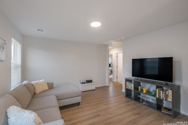 living room with light hardwood / wood-style flooring