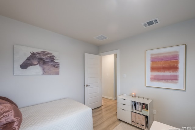 bedroom with light hardwood / wood-style flooring