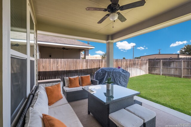 view of terrace with outdoor lounge area and ceiling fan