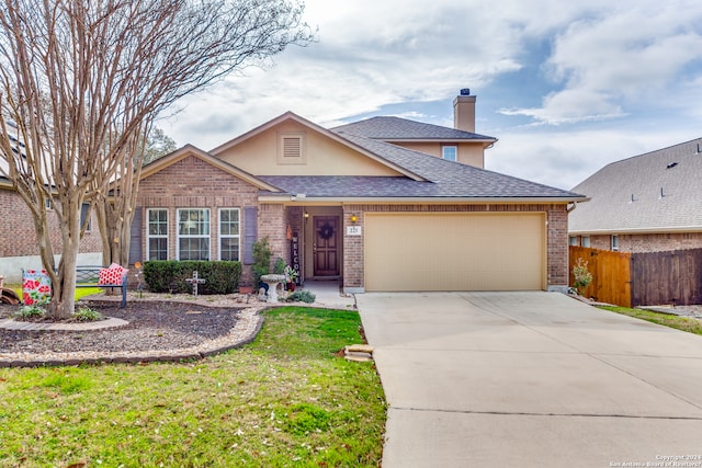 ranch-style home featuring a front lawn and a garage