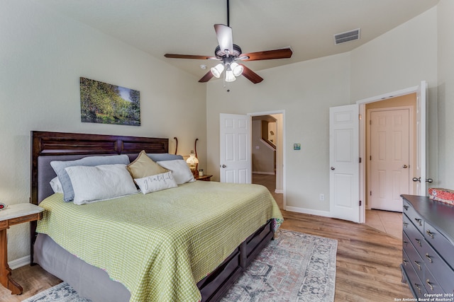 bedroom with ceiling fan and light wood-type flooring