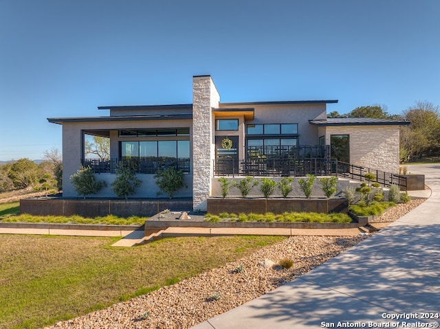 modern home with a front yard