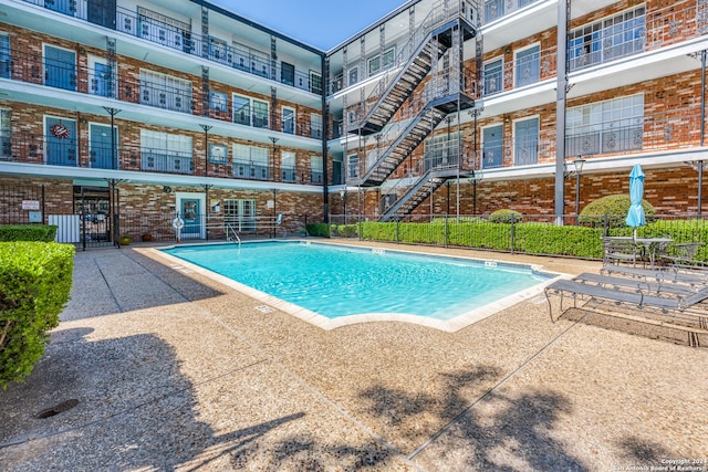 view of pool featuring a patio