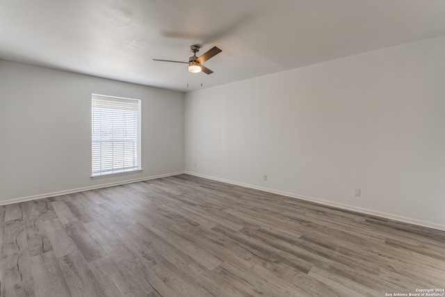 spare room featuring ceiling fan and wood-type flooring