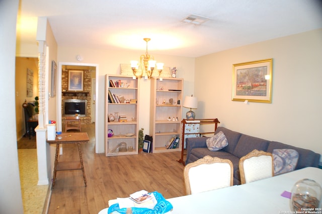 dining area featuring an inviting chandelier and light hardwood / wood-style floors