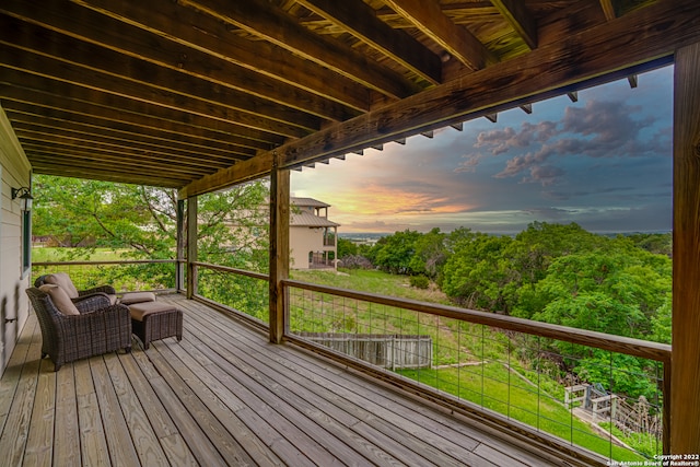 deck at dusk with a yard