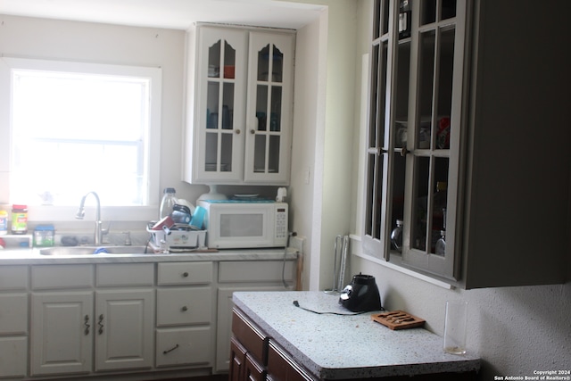 kitchen with white cabinets and sink